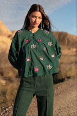 Blusa con bordo floreale